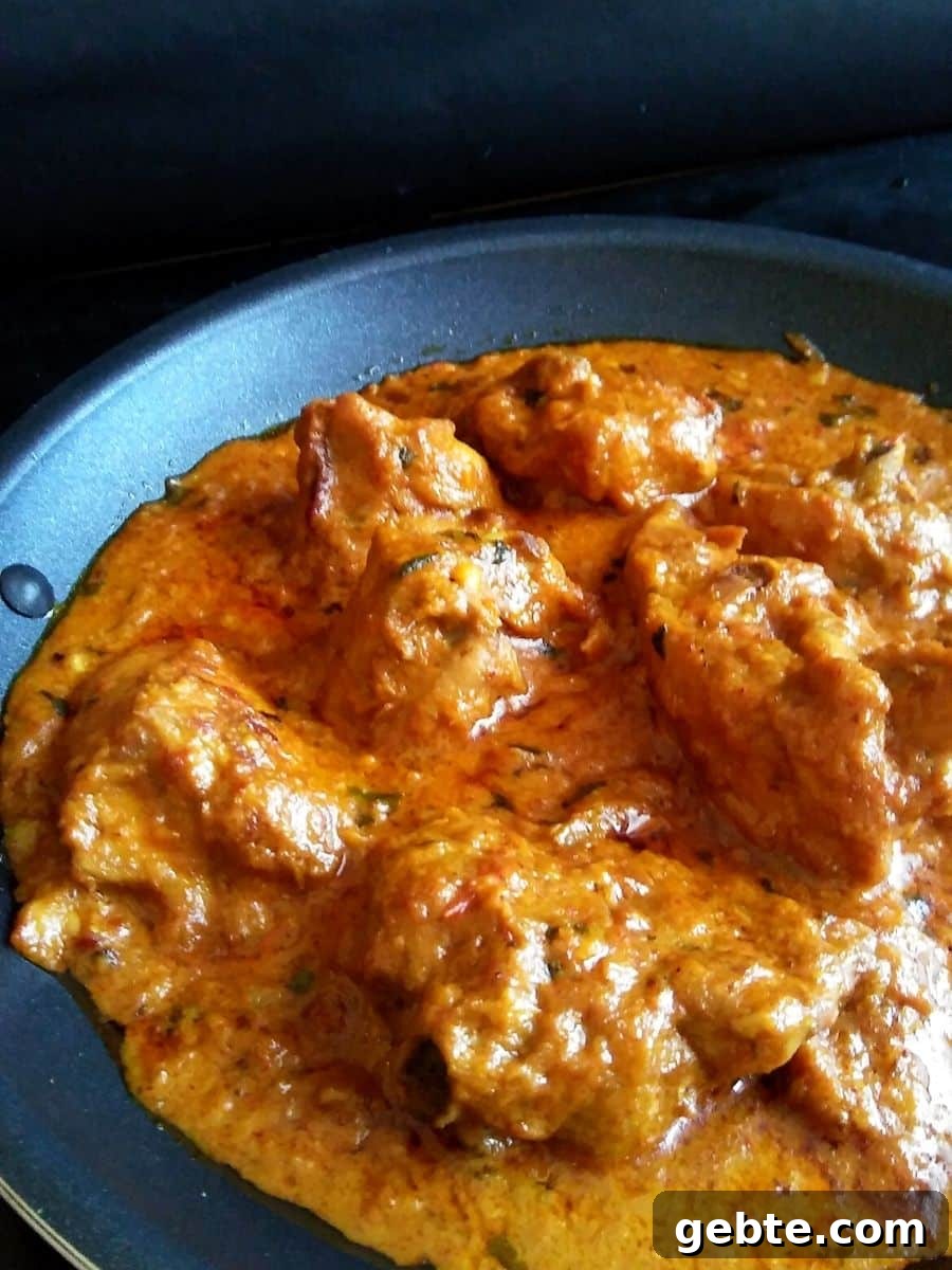 Restaurant-Style Mughlai Chicken Changezi Recipe 2 Image showing vibrant looking murgh changezi in a nonstick pan.