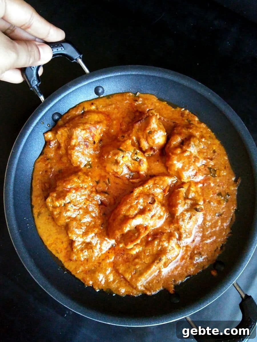 Restaurant-Style Mughlai Chicken Changezi Recipe 3 Image showing changezi chicken in a nonstick pan.