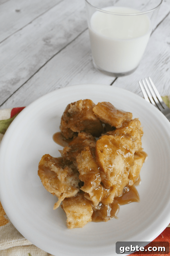 Pressure Cooker Caramel Pumpkin Spice Bread Pudding 4 Close-up of a slice of pumpkin spice bread pudding drizzled with caramel