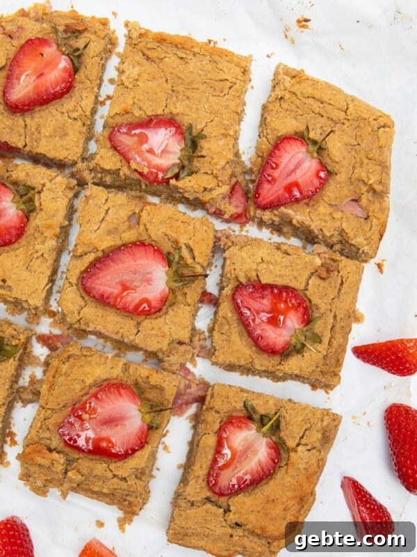 Peanut Butter Blondies with strawberries on top.