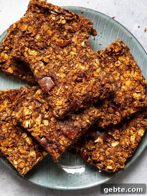 chocolate flapjacks sliced into squares served on a blue plate.