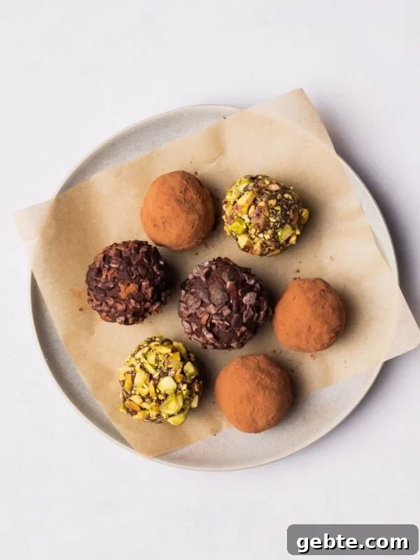 Vegan Chocolate Truffles on a plate with different toppings.