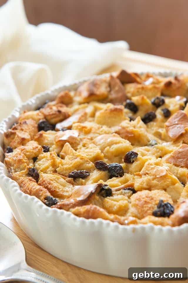 Cinnamon Bread Pudding in White Dish with Raisins