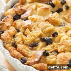 Bread Pudding In a White Dish with Raisins