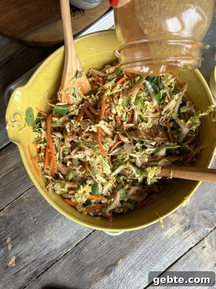 Adding dressing to salad