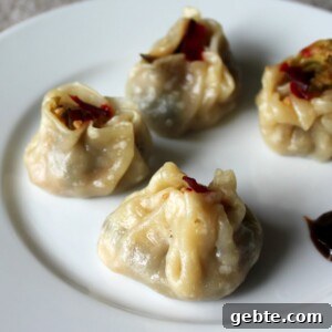 Shu Mai dumplings served on a white plate