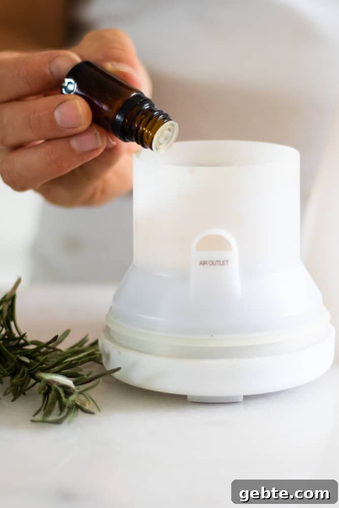 How to Use Rosemary Essential Oil: Blends and DIY Recipes 4 rosemary essential oil going in white diffuser