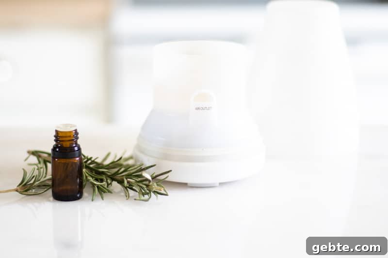 How to Use Rosemary Essential Oil: Blends and DIY Recipes 6 rosemary essential oil bottle and white diffuser