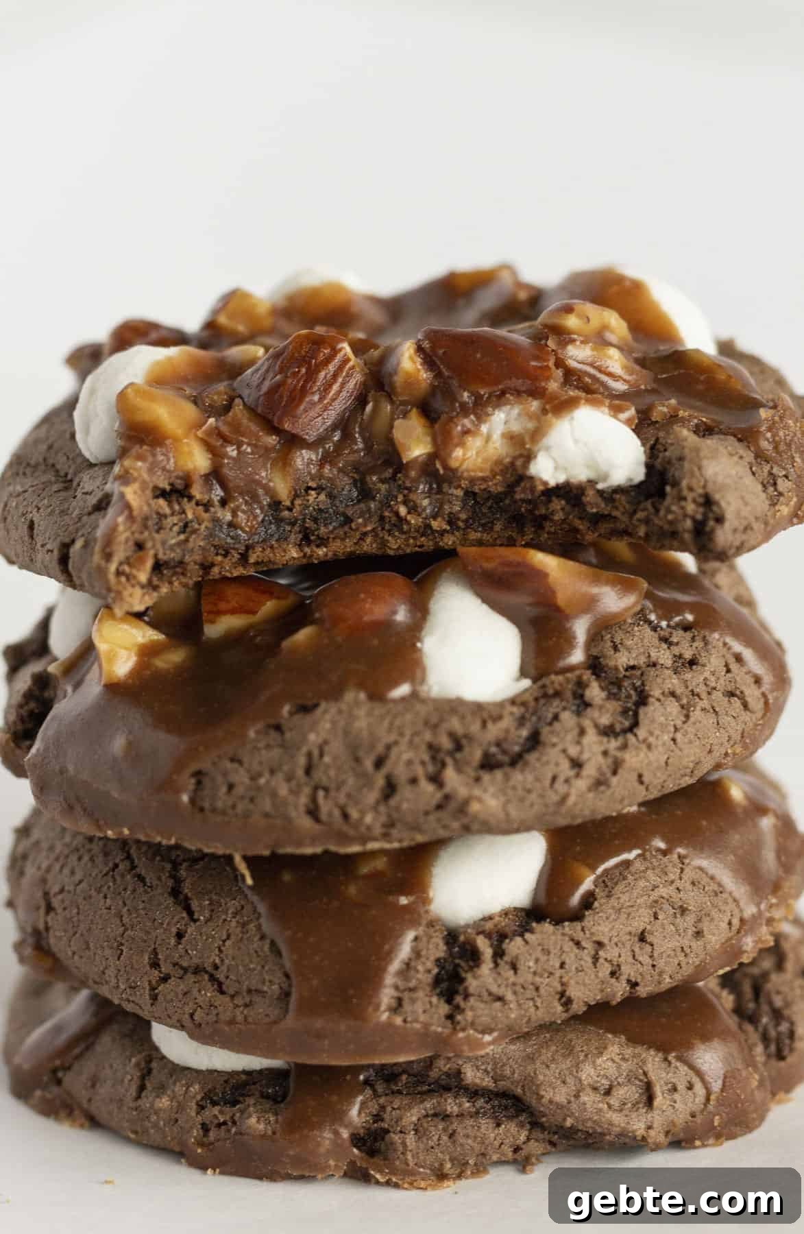 Four rocky road cookies stacked on each other.