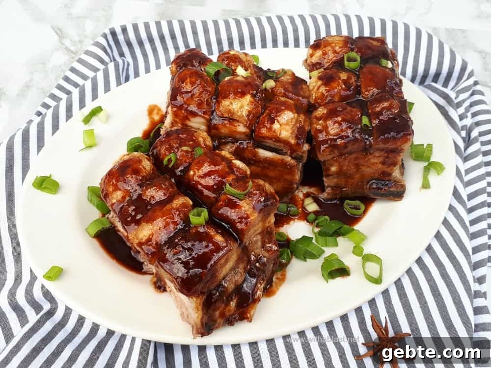 Sticky Pork Belly is an Asian inspired recipe, the meat is super tender and the top is the crispiest (crackling) ever Sticky Pork Belly (Asian Inspired)