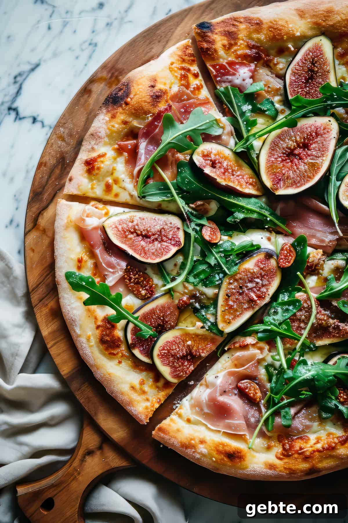 Prosciutto and Arugula Pizza with Balsamic Glaze 2 Arugula and prosciutto pizza on homemade pizza crust.