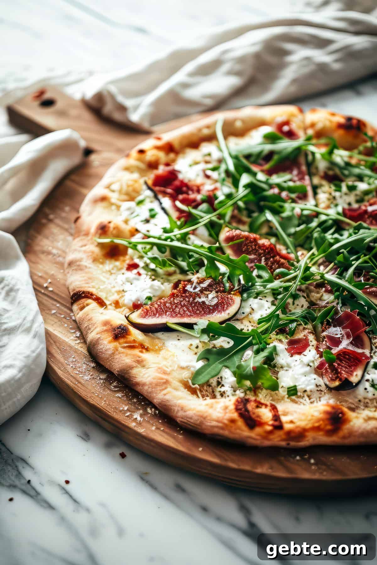 Prosciutto and Arugula Pizza with Balsamic Glaze 4 Arugula and prosciutto pizza on homemade pizza crust.