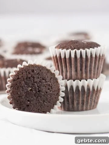 three brownies on a small white plate.