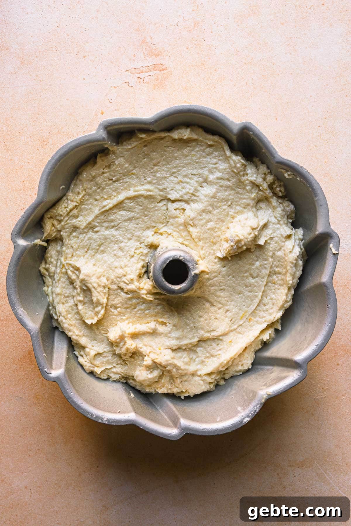 A bunt pan with cake batter.