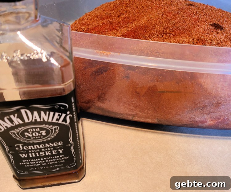 Rubbed and injected pork shoulder with Jack Daniels bottle