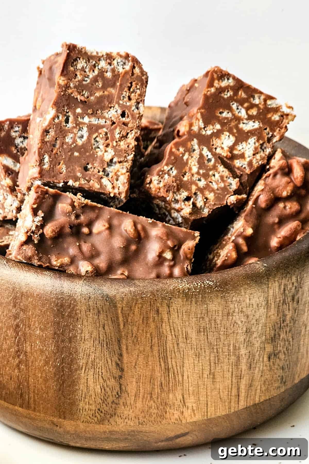 Homemade crunch bars in a wooden bowl.