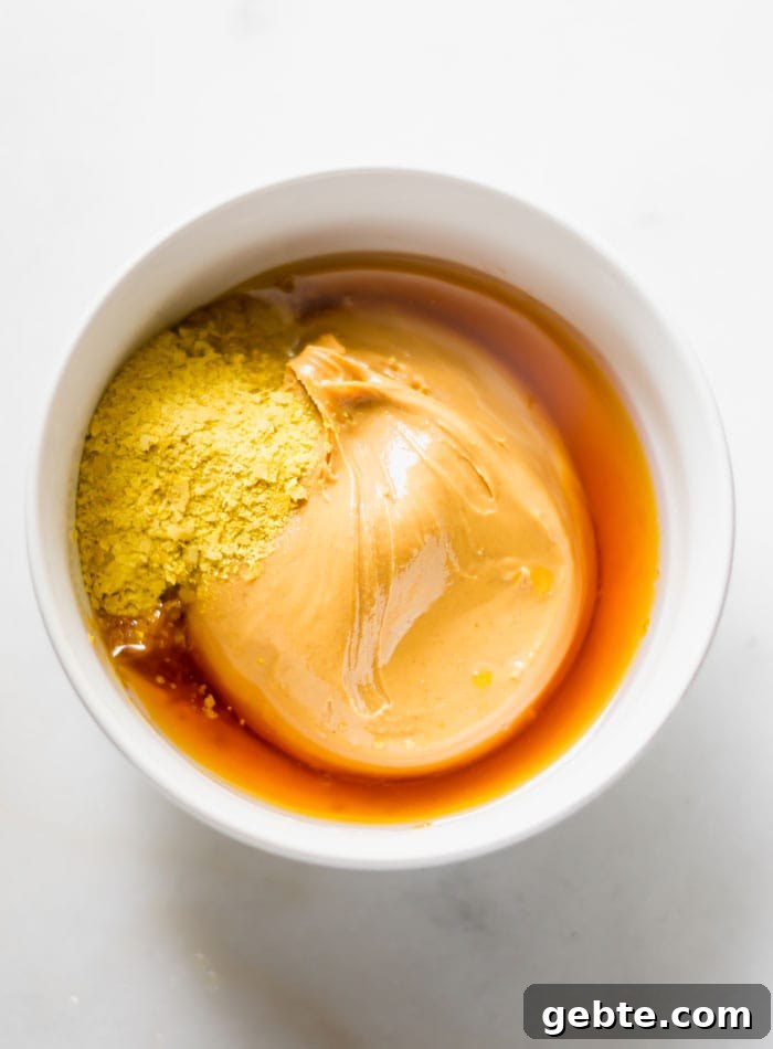 Peanut butter and nutritional yeast in a small bowl.