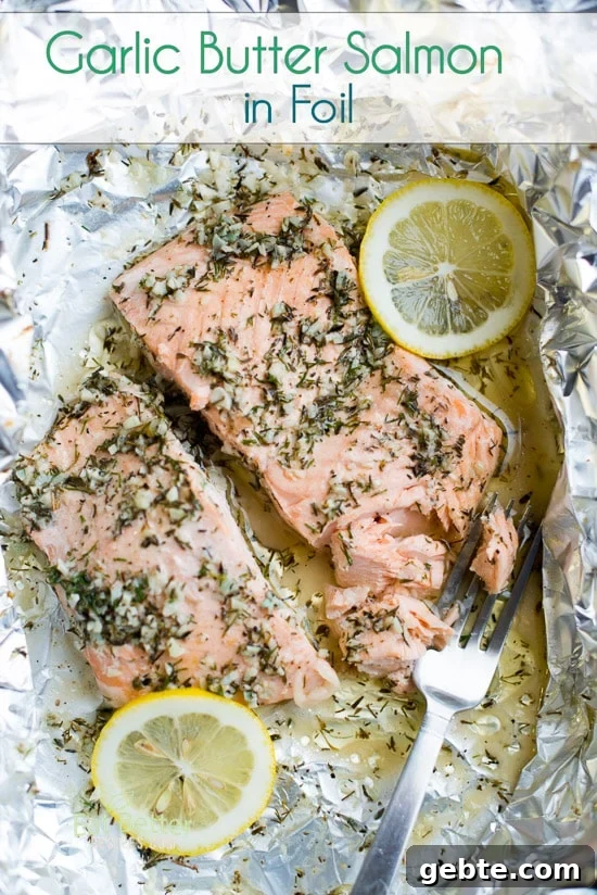 Foil Pack Garlic Salmon in a foil pack with a fork and lemons