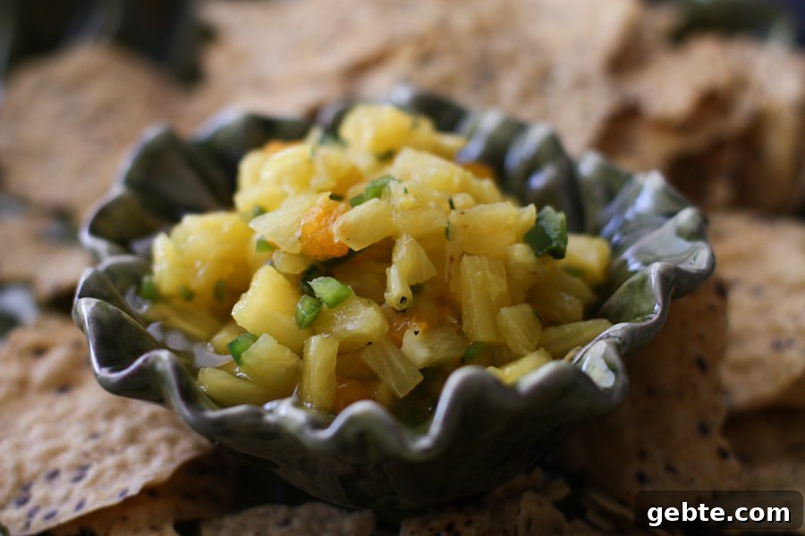 The BEST Pineapple Salsa!! Fresh and fruity with just a little kick. Pair it with your favorite tortilla chips or serve over grilled chicken or fish. Delicious!