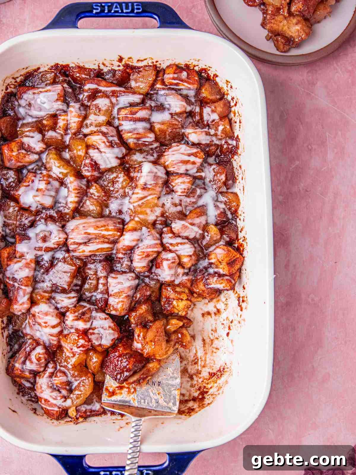Cinnamon roll apple pie in a casserole dish.