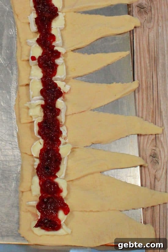 Cranberry and Brie Crescent Bake 4 Cranberry Brie Crescent Bake is fun and easy to make using only three ingredients.